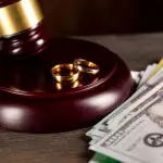 McAllen divorce attorney reviewing credit card and loan documents with a client
