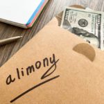 brown sheet of paper with the word alimony on it and cash from a family law attorney mcallen.